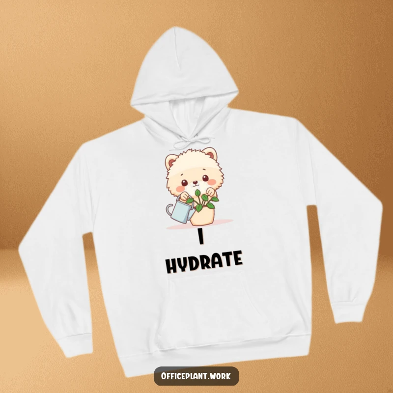 Funny cozy hoodie with a fluffy animal peeking over a desk plant holding a tiny watering can, offering warm humorous apparel.