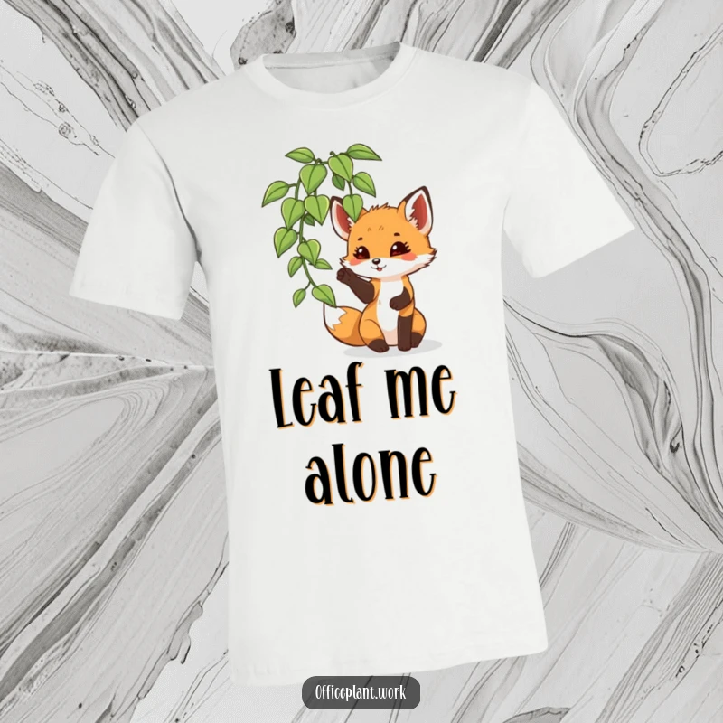 Funny fox cub t-shirt, playfully batting at an office plant leaf, ideal for those who enjoy lighthearted fun.