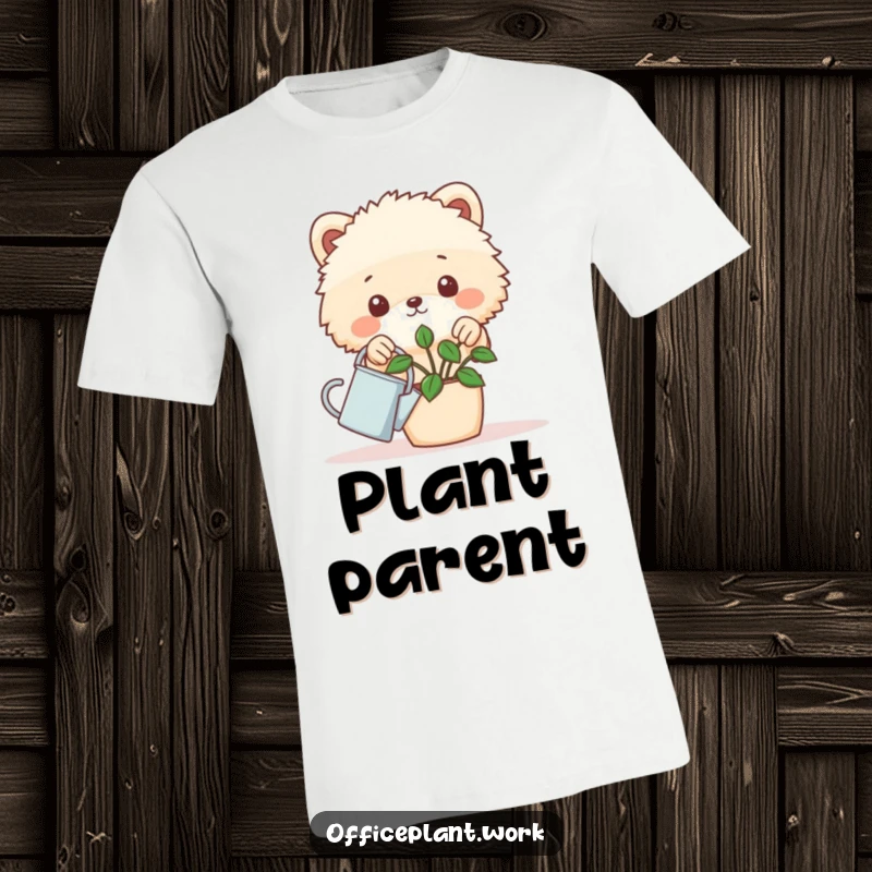 Funny fluffy animal peeking over a desk plant with a tiny watering can on a t-shirt, a humorous gift for plant lovers.